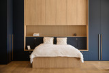 chambre à coucher avec armoires sur mesure en bleu foncé dans le showroom camber à aartselaar